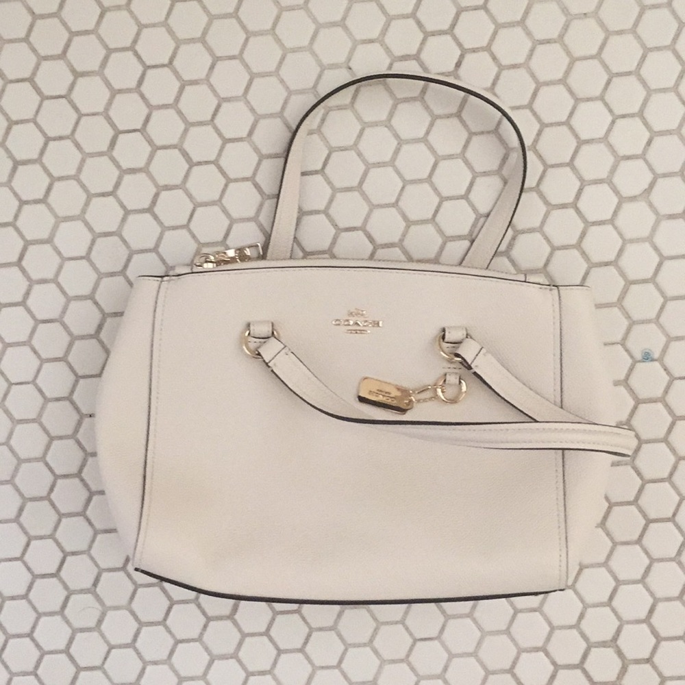 coach creme colored handbag